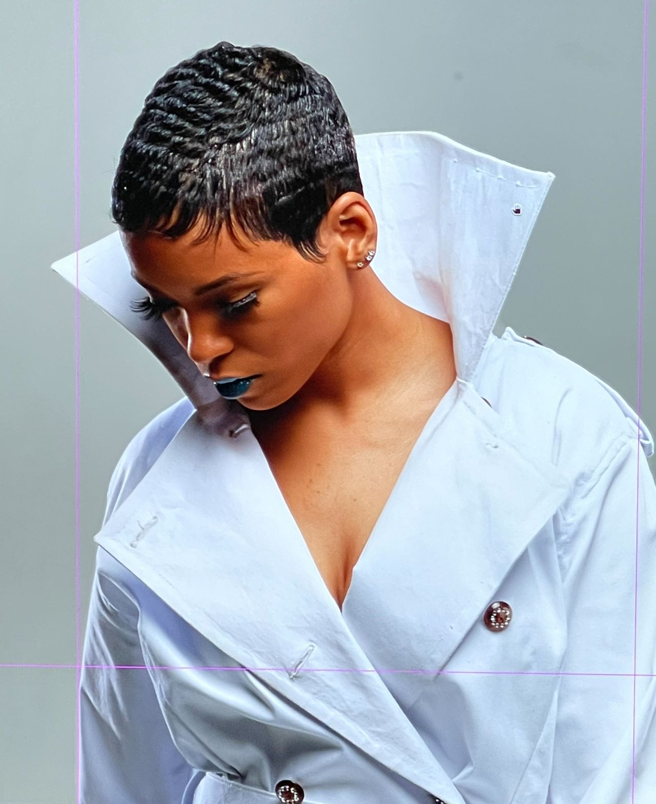 Sleek short waves styled at DiVine Stylez — editorial portrait in a white trench